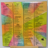 Colorful album cover with text on a stand