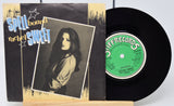 Vinyl record and cover with 'Spellbound Rachel Sweet' on a white background