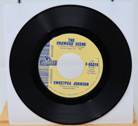 45 RPM record with yellow label featuring 'The Crawdad Scene' and 'Sweetpea Johnson' on a white background.