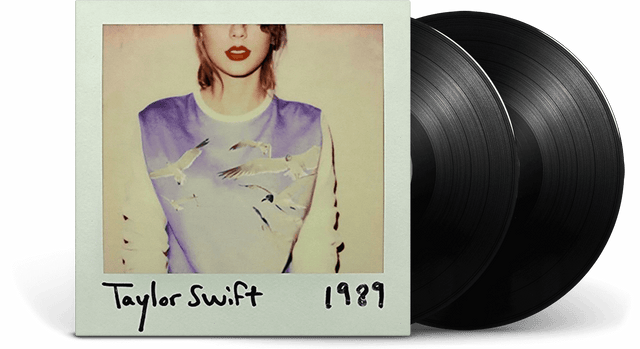 Vinyl record with '1989' by Taylor Swift and a Polaroid-style photo of the artist.