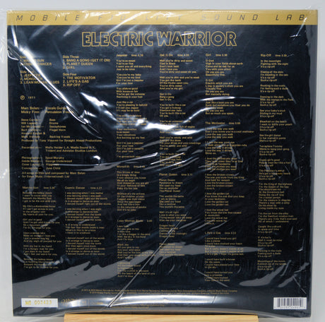 The back cover of the Electric Warrior vinyl record LP by Mobile Sound Lab, sealed in its original plastic shrink wrap. The cover is black with gold text and features a tracklist.