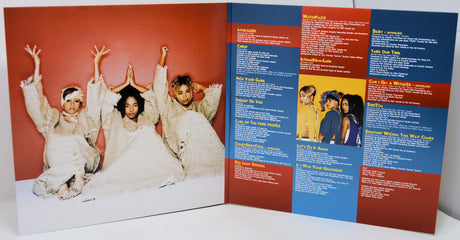 Vinyl record cover with a group of people on the left and text on the right.