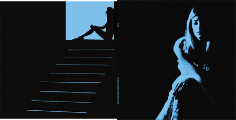 Silhouette of a person sitting on stairs with another person standing, set against a dark background.