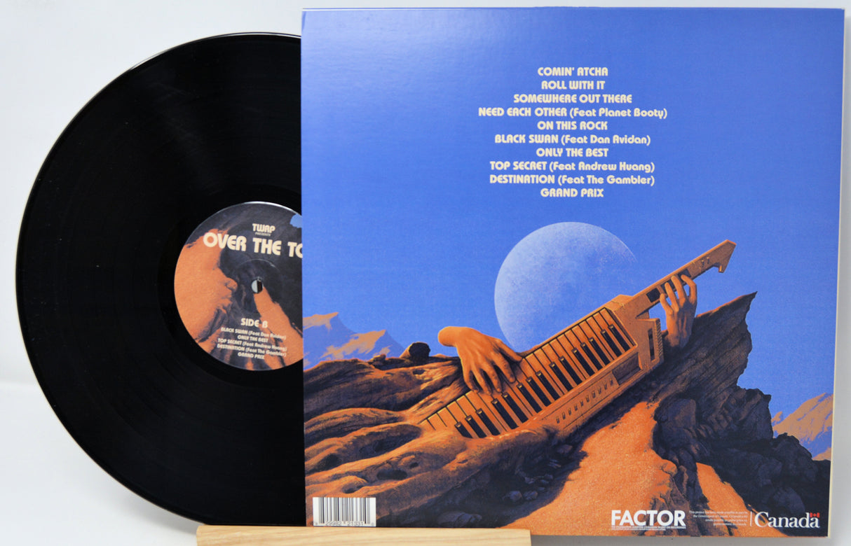 Vinyl record with a blue cover featuring an orange spaceship and desert landscape.