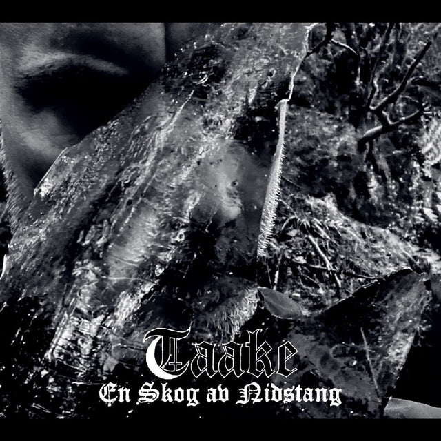 Black and white image of a forest with the text 'Taaake En Skog av Nidstang' displayed.