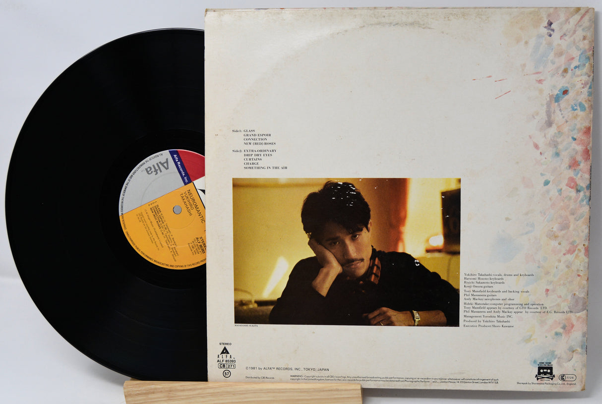 Vinyl record with a person on the cover and a white label