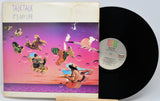 Vinyl record with colorful cover featuring abstract designs and 'Talk Talk' album text.