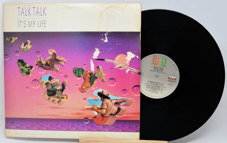 Vinyl record with colorful cover featuring abstract designs and 'Talk Talk' album text.