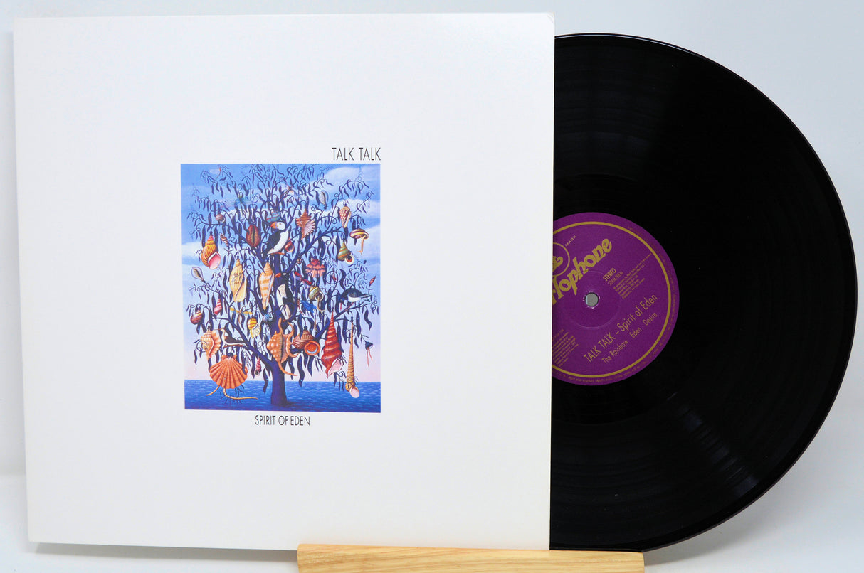 Vinyl record with cover featuring 'Talk Talk' album art on a white background