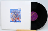 Vinyl record with cover featuring 'Talk Talk' album art on a white background