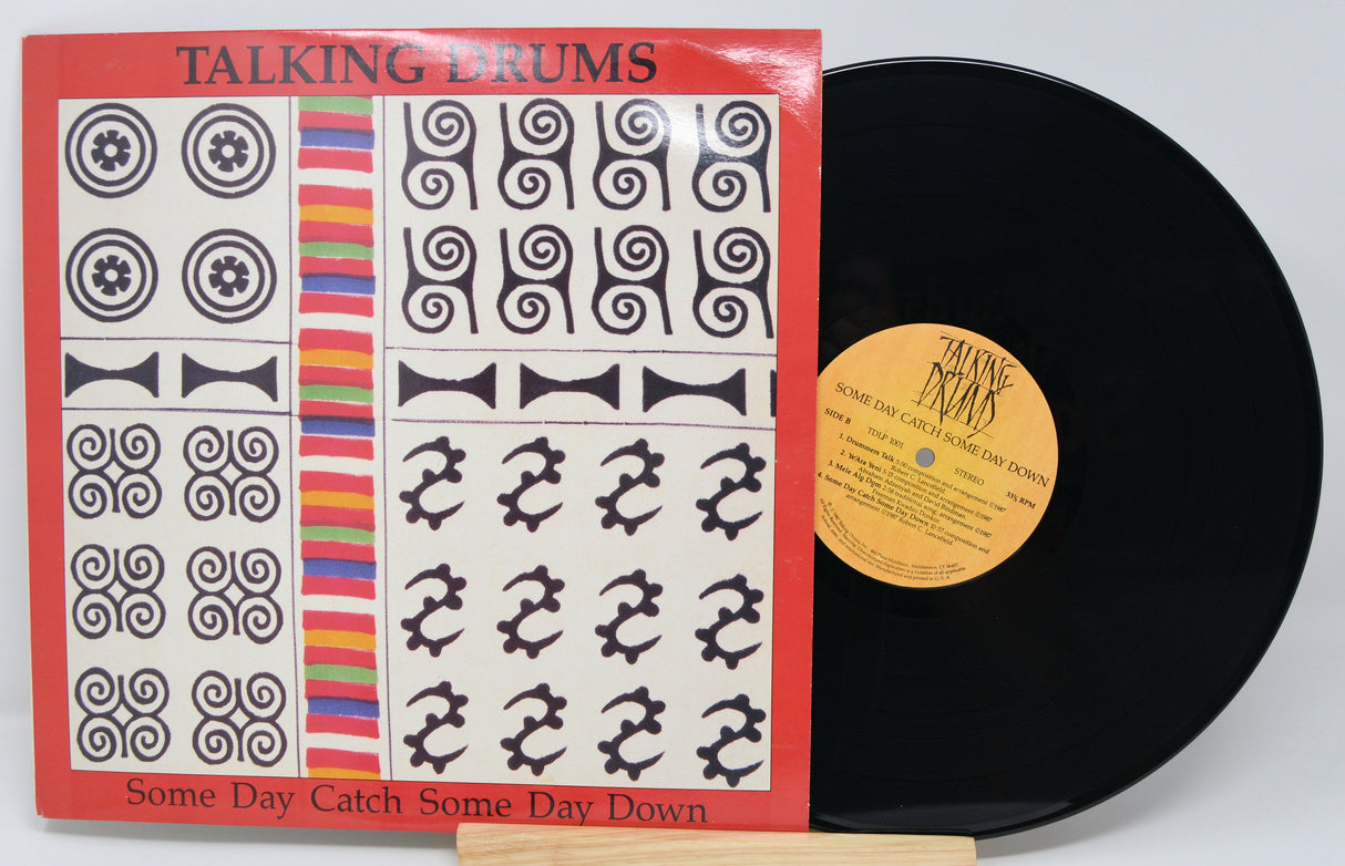 Front cover of Talking Drums 'Some Day Catch Some Day Down' vinyl record with vivid artwork