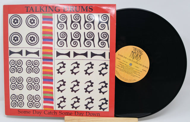 Front cover of Talking Drums 'Some Day Catch Some Day Down' vinyl record with vivid artwork