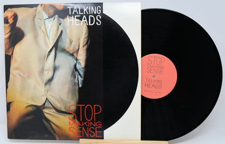 Vinyl record with 'Talking Heads' album cover showing a person in a suit.