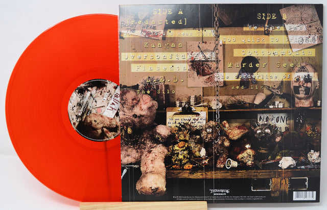 Back cover of Tallah Matriphagy orange vinyl LP, featuring tracklist and disturbing art