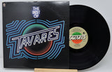 Vinyl record with cover featuring a group of people on a light green background