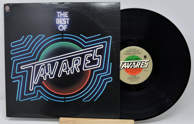Vinyl record with cover featuring a group of people on a light green background