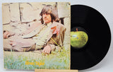 Vinyl record 'James Taylor - Self Titled' with front cover featuring a person sitting outdoors, on a light gray background