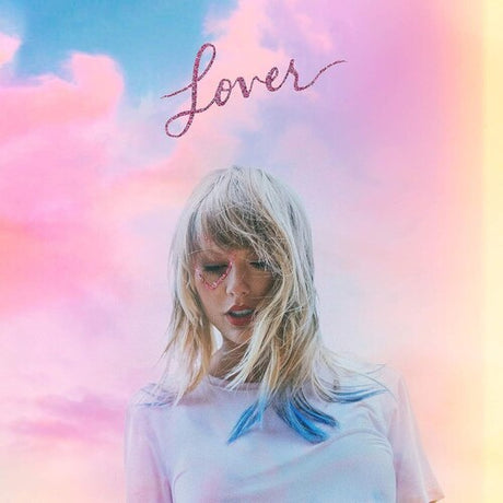 Taylor Swift album 'Lover' cover art featuring Taylor Swift with blonde hair against a colorful pastel background with the album title 'Lover' written in a cursive font at the top.