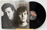 Vinyl record with 'Tears for Fears - Songs From The Big Chair' album cover showing two faces.