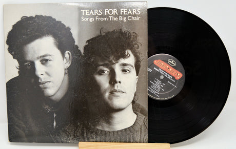 Vinyl record with 'Tears for Fears - Songs From The Big Chair' album cover showing two faces.