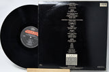 Vinyl record with cover displaying tracklist on a white background