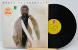 Vinyl record with cover featuring a man and album details