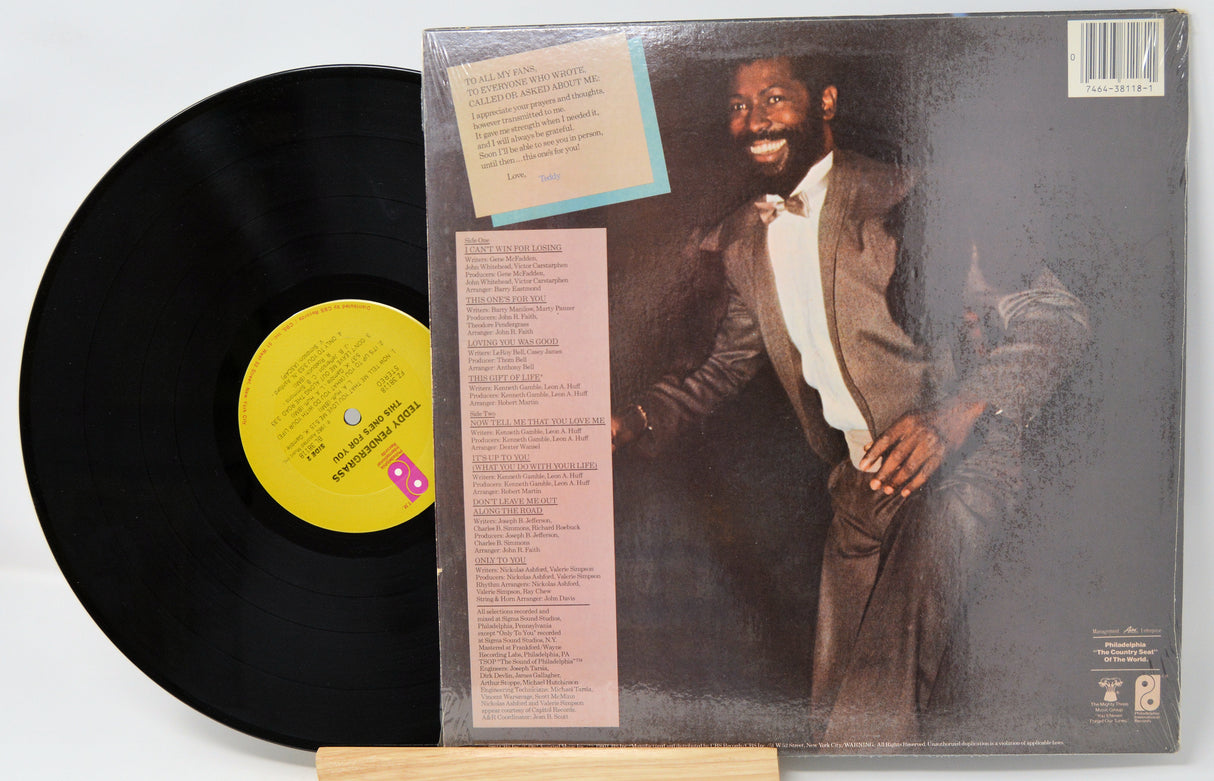 Vinyl record with a cover featuring a man in formal attire on a white background