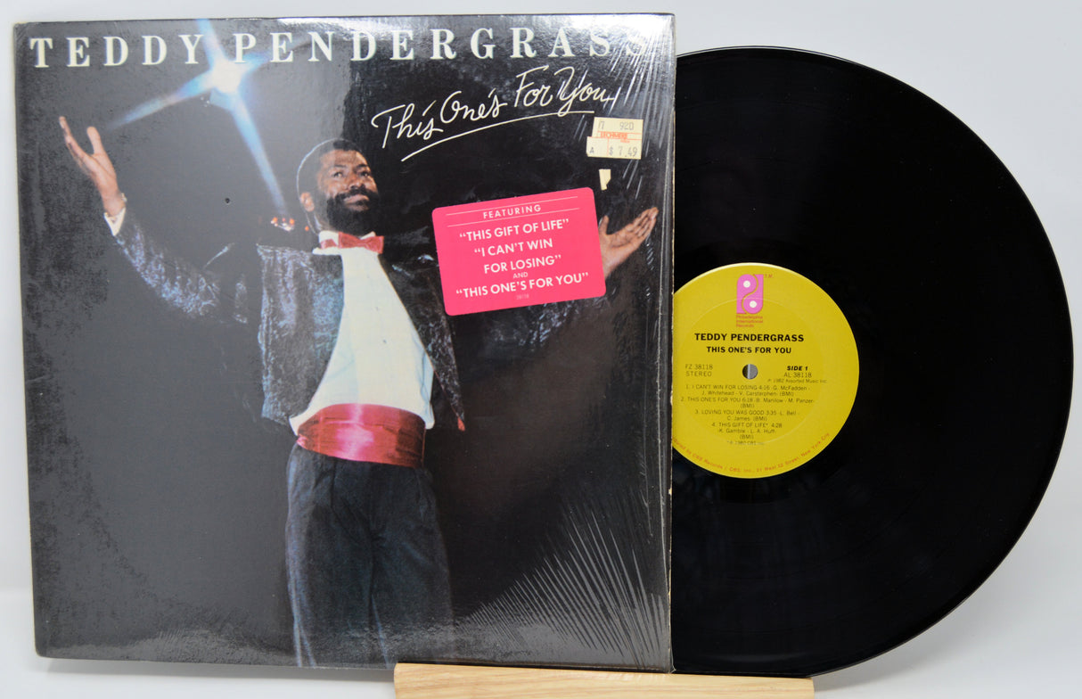 Vinyl record and cover with Teddy Pendergrass on a white background