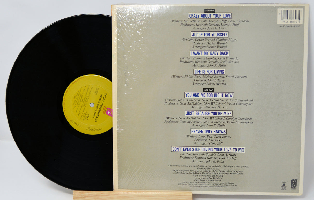 Vinyl record with yellow label and back cover with text