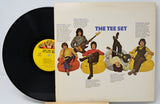 Vinyl record with a colorful cover featuring illustrations of people playing instruments.