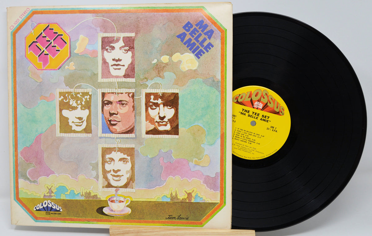 Vinyl record with colorful cover featuring faces and a yellow label.