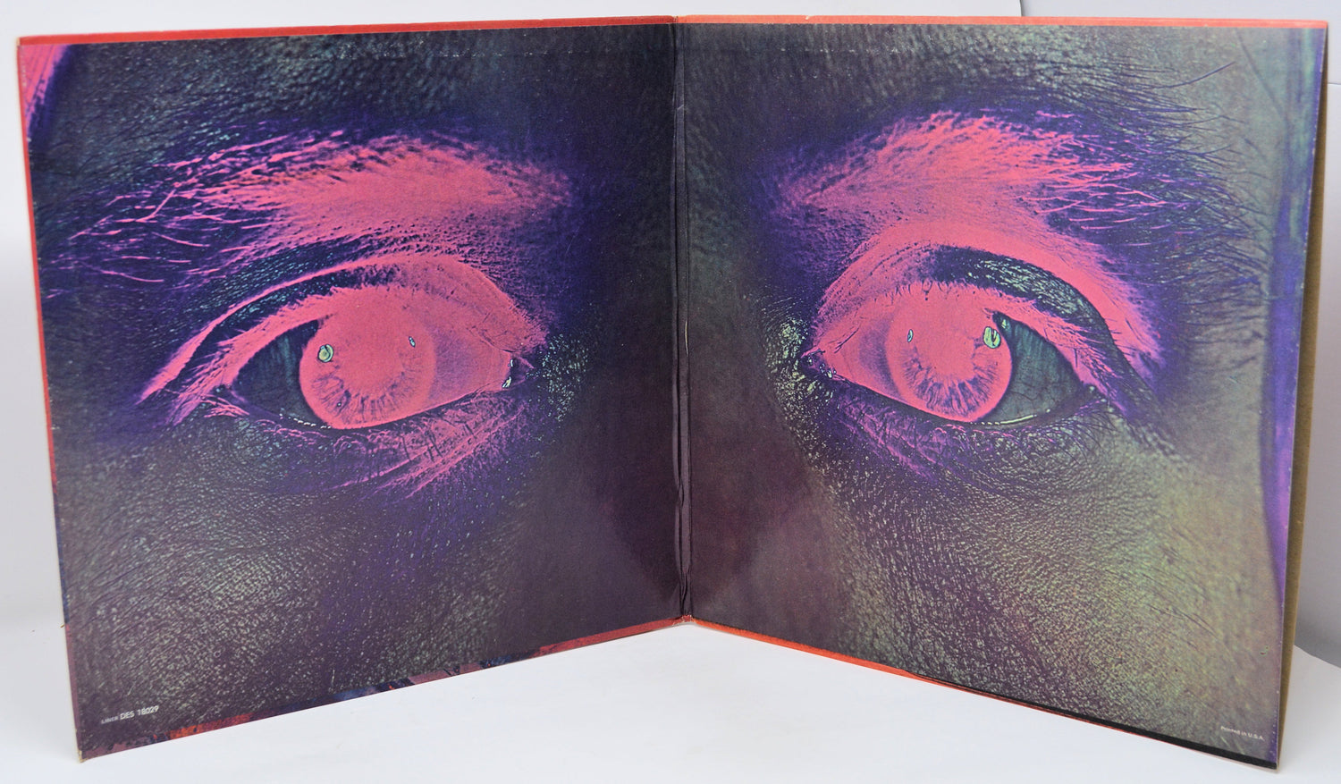 Inside gatefold album cover of 'Ten Years After Ssssh' with a stylized eye design on a textured surface