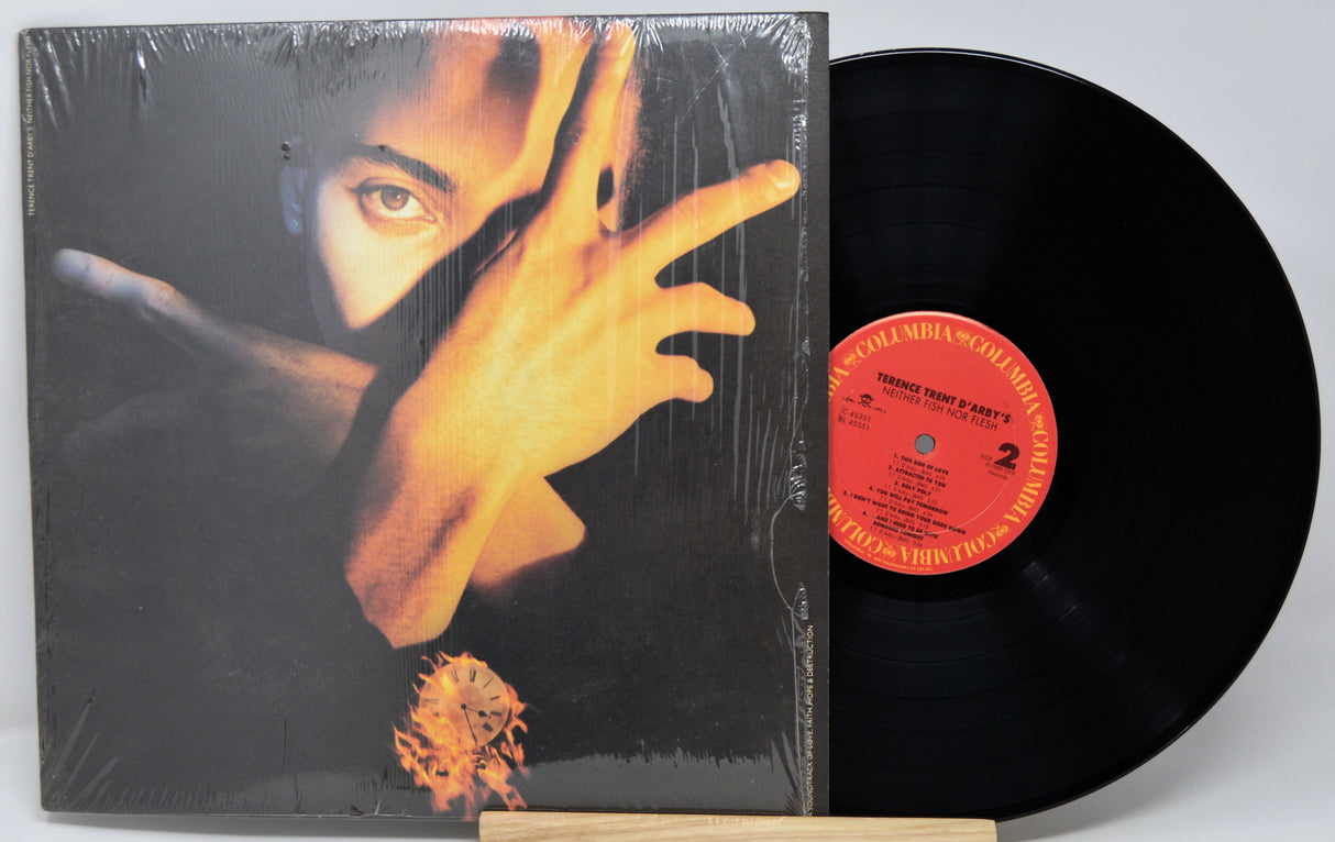 Vinyl record with a person's face and hand on the cover