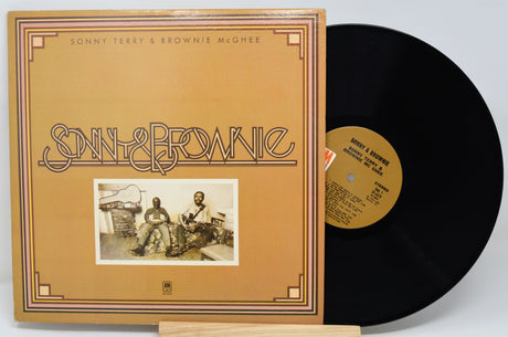 Vinyl record and cover with 'Sonny & Brownie' on a light gray background