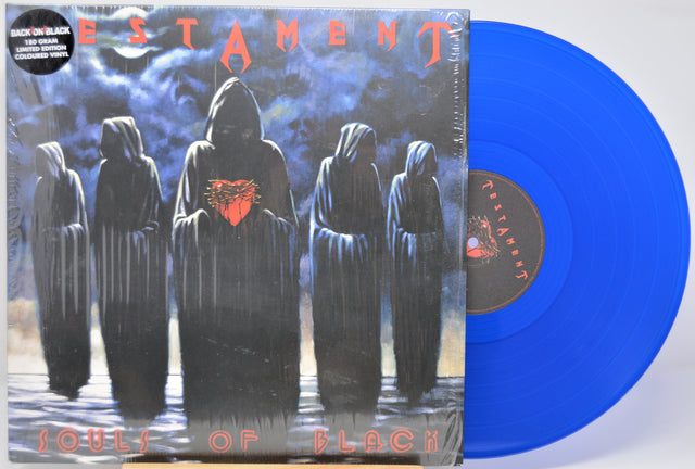 Vinyl record with 'Testament' 'Souls Of Black; album cover featuring hooded figures and blue disc.