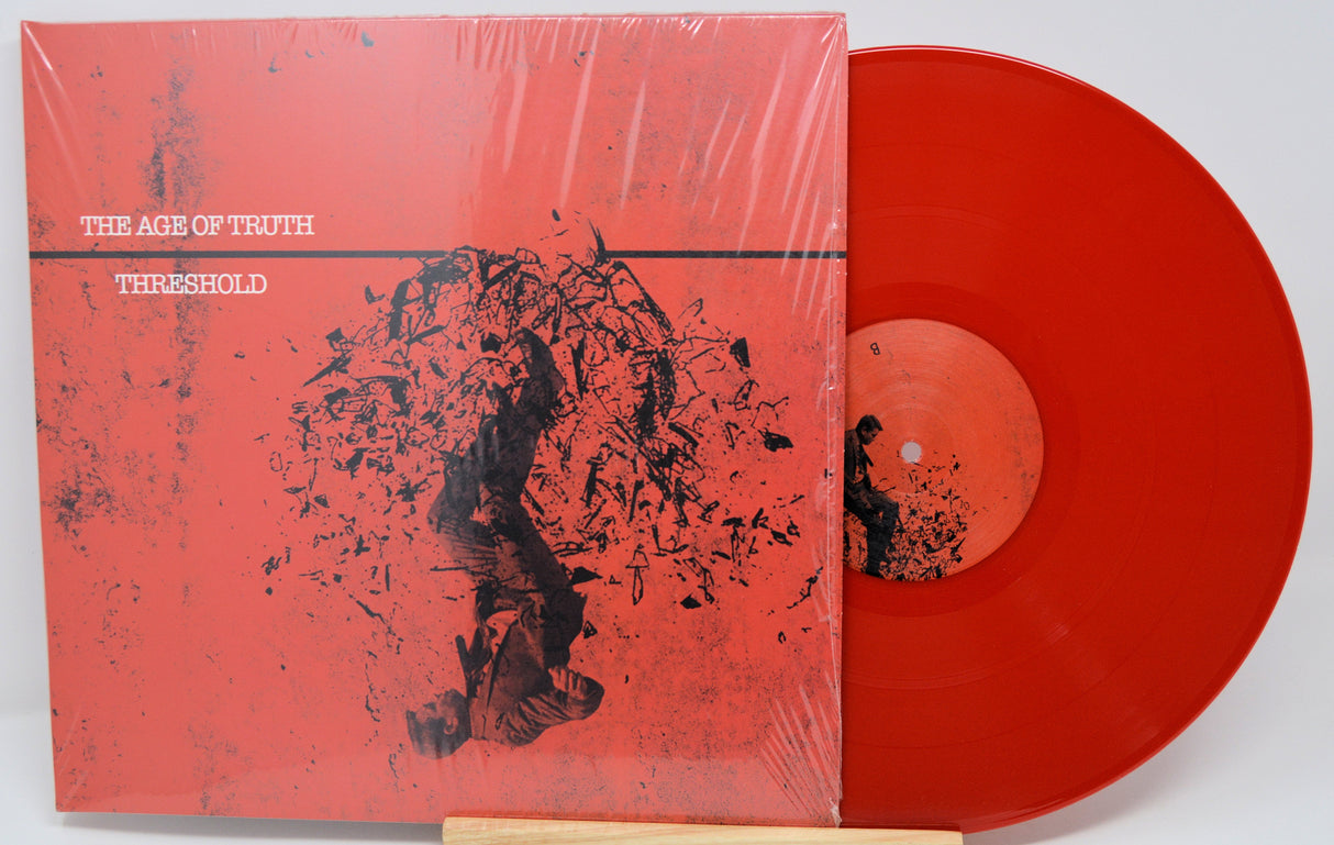 Front cover of The Age of Truth Threshold red vinyl LP with abstract art