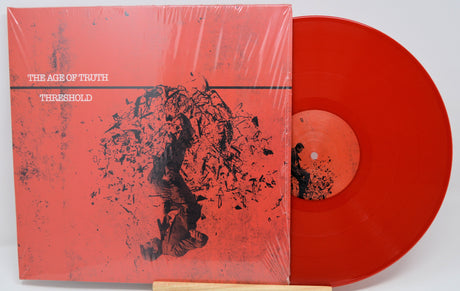 Front cover of The Age of Truth Threshold red vinyl LP with abstract art