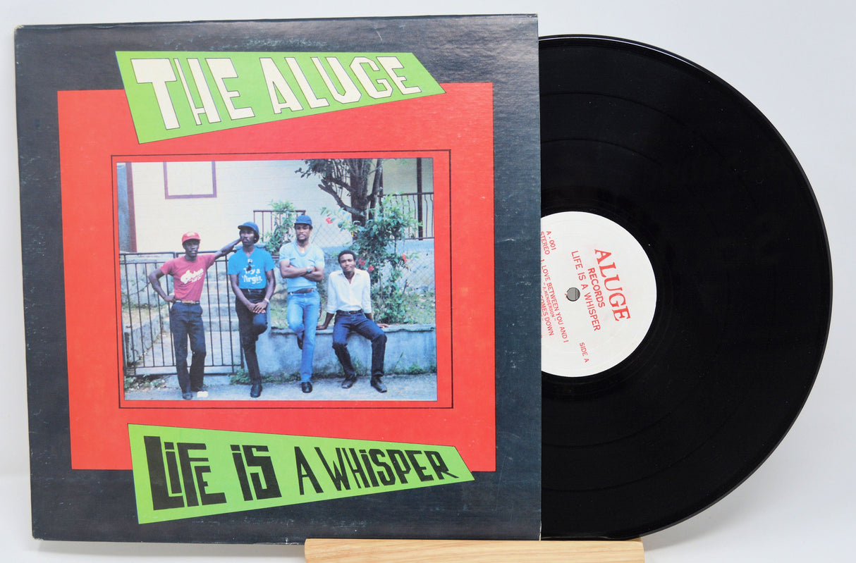 Front cover of The Aluge 'Life Is a Whisper' vinyl LP featuring four band members