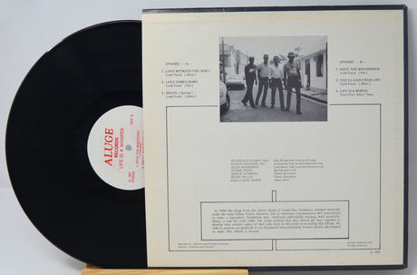 Back cover of The Aluge 'Life Is a Whisper' vinyl LP with tracklist and band photo