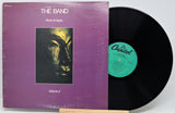 The Band's 'Rock of Ages Volume 2' vinyl record LP, showing the purple cover sleeve with the album artwork and the black record partially pulled out, revealing the green Capitol label.
