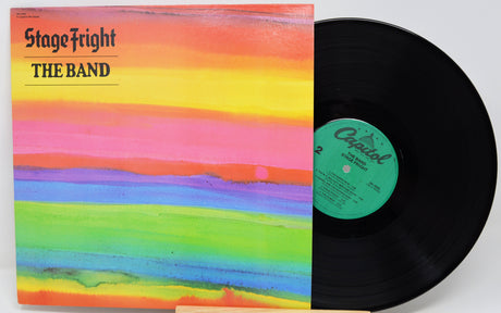 Vinyl record with a colorful cover titled 'Stage Fright' by The Band on a white background.