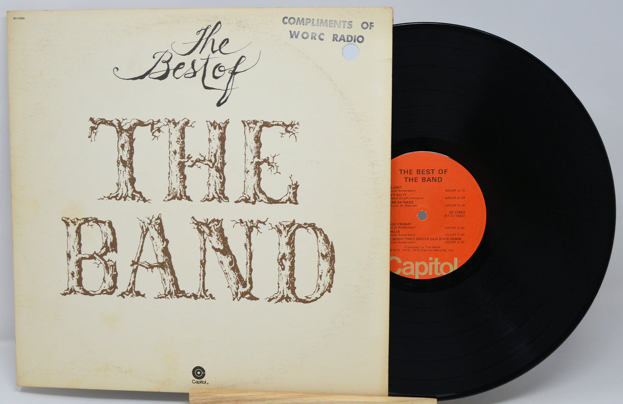 Vinyl record and cover titled 'The Best of The Band' on a light gray background