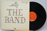 Vinyl record and cover titled 'The Best of The Band' on a light gray background