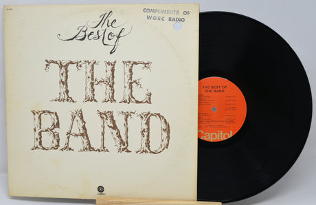 Vinyl record and cover titled 'The Best of The Band' on a light gray background