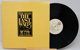 Vinyl record and cover of 'The Last Waltz' by The Band on a gray background