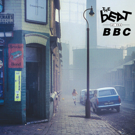 Vintage street scene with The Beat at the BBC album cover art, showcasing a misty alley and retro cars