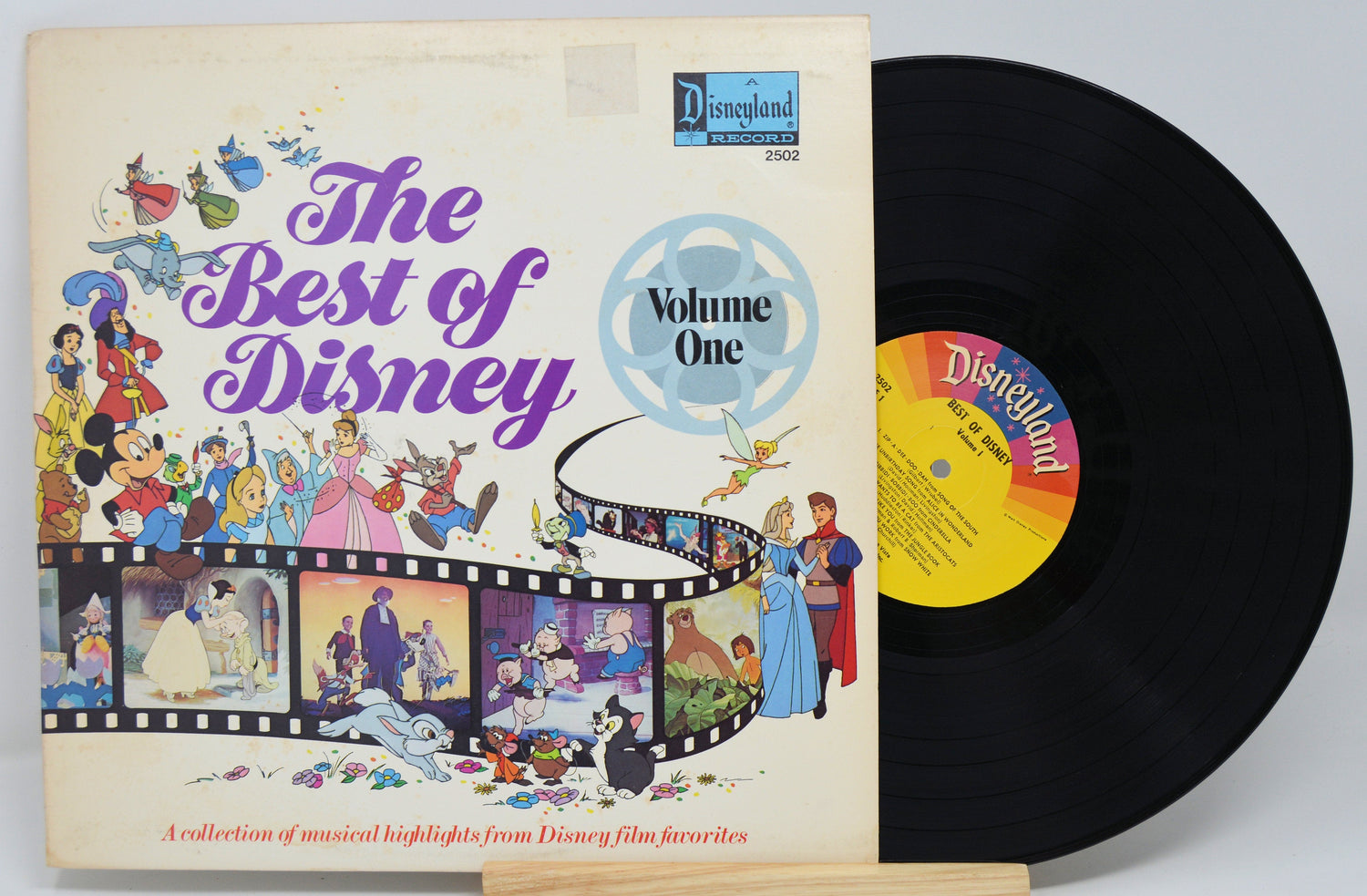 Front cover and vinyl of The Best of Disney Volume One with iconic Disney artwork and musical highlights