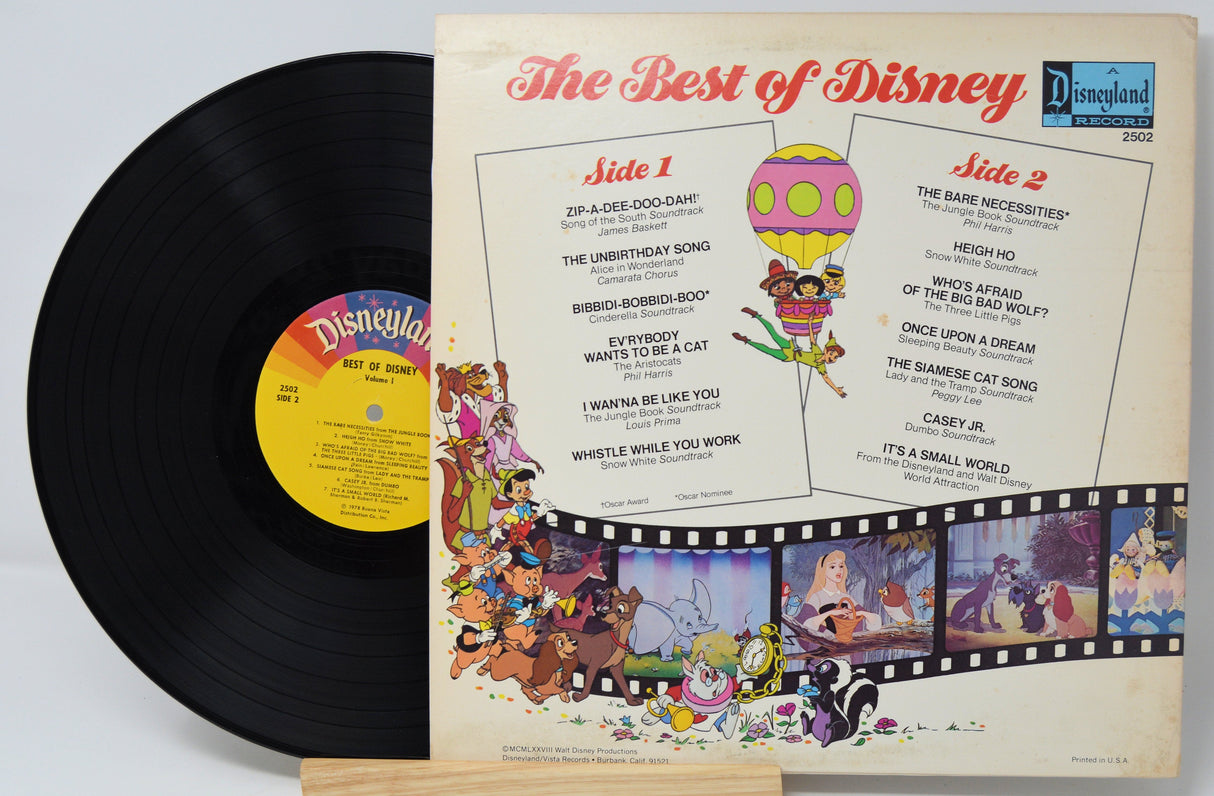 Back cover and vinyl of The Best of Disney Volume One record with tracklist and classic Disney characters