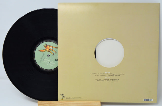 The Blakes vinyl record partially out of its back cover showing full tracklist