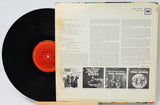 Vinyl record with cover featuring text and black and white images of band members.